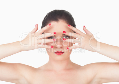 Woman with red lips and red painted finger nails over face