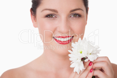 Close-up of young woman holding flower