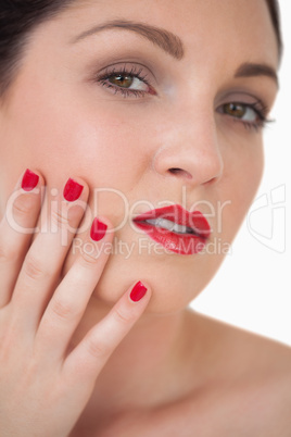 Woman red painted finger nails and red lips