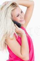 Side view of happy casual woman using cellphone