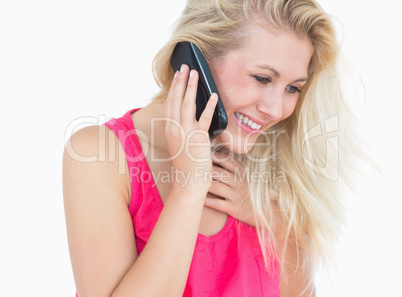 Side view of happy casual woman using cellphone