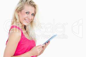Portrait of happy casual woman with digital tablet