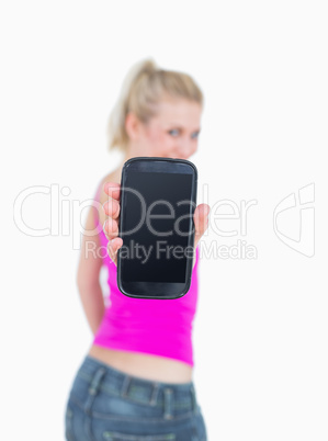 Portrait of casual woman showing you her new smartphone