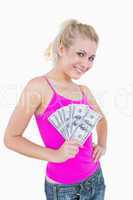 Portrait of happy woman holding fanned us banknotes