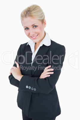 Portrait of confident young business woman standing with arms cr