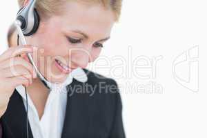 Close-up of young business woman wearing headset