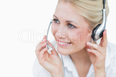 Close-up of young female executive wearing headset