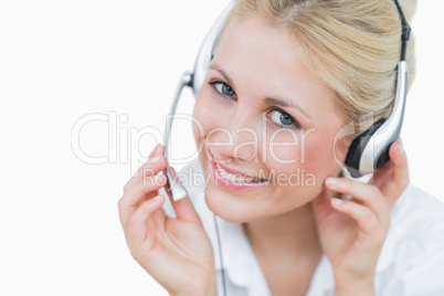 Close-up portrait of young female executive wearing headset