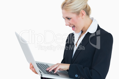 Young business woman using laptop