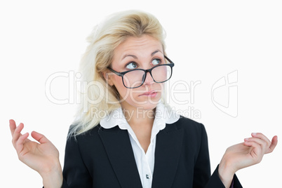 Young business woman gesturing do not know sign