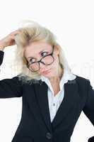 Frustrated business woman scratching head