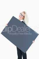 Portrait of happy business woman holding blank board