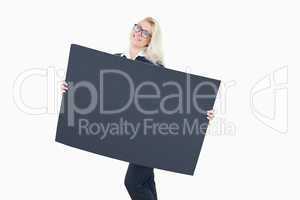 Young business woman holding a blank board