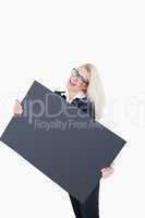 Portrait of cheerful business woman holding empty banner