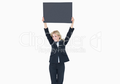 Portrait of young business woman holding up empty banner Portrait of young business woman holding up empty banner
