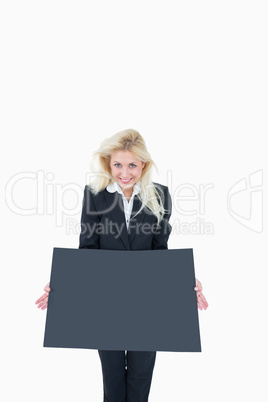 Portrait of business woman holding empty banner