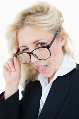 Close-up portrait of beautiful business woman winking