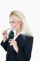 Thoughtful attractive young business woman with glasses