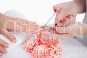 Woman cutting fingernail