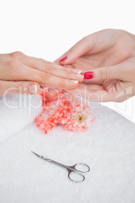 Close-up of woman getting manicure done