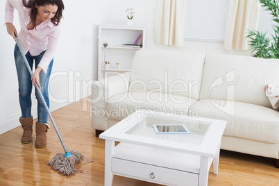 Woman  mopping living room floor