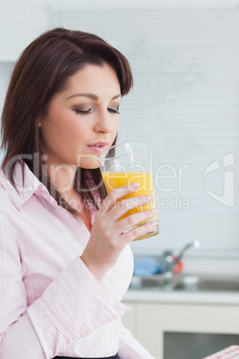 Woman drinking orange juice