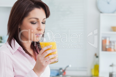 Woman drinking orange juice