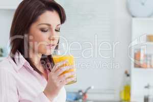 Woman drinking orange juice