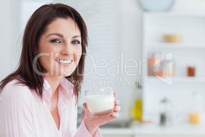 Young woman with glass of milk