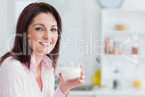 Young woman with glass of milk