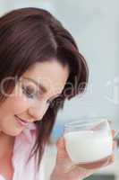 Young woman with glass of milk