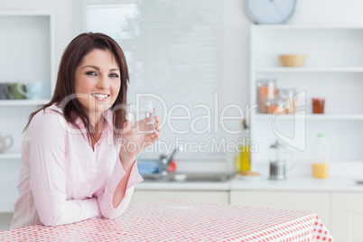 Young woman with glass of water