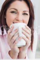 Close-up of woman with coffee cup