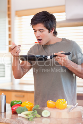 Young man cooking in the kitchen