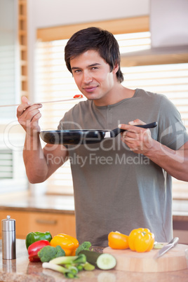 Man cooking food in the kitchen