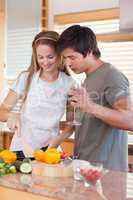 Happy couple cooking food together