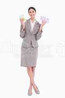 Happy business woman holding fanned banknotes