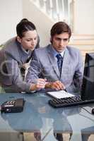 Business colleagues at office desk