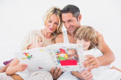 Happy family reading a story together