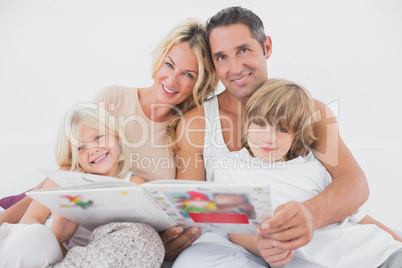Happy family reading a fairy tale together