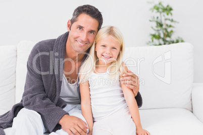 Father and child looking at camera