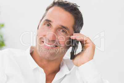 Smiling man phoning