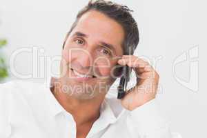 Smiling man phoning