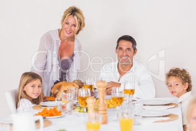 Mother putting a turkey on the table