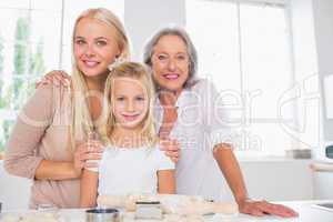 Cheerful mothers and daughters cooking together