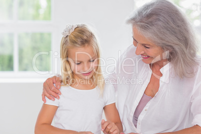 Grandmother talking with her granddaughter