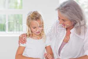 Grandmother talking with her granddaughter