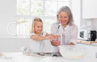 Grandmother and granddaughter washing hands