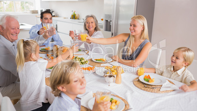 Happy family raising their glasses