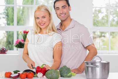 Blonde woman cooking with her husband